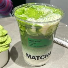 matcha green tea in a plastic cup on a table