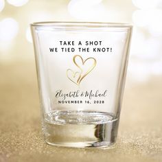 a shot glass with the words, take a shot we tied the knot