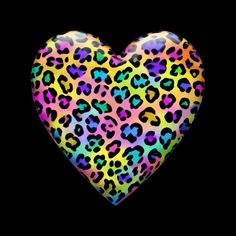 a heart shaped animal print on a black background with the colors of rainbow, yellow, and blue