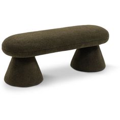 the foot stool is made out of wool and has a rounded shape, with a curved top