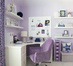 a purple chair sits in front of a white desk and shelving with pictures on it