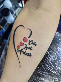 a woman's arm with two hearts on it