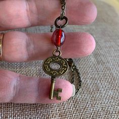 Skeleton Key Vintage Red Glass Bead Necklace Handmade By Twinsdesign Nwot One Of A Kind 18” Chain With Lobster Claw Clasp Necklace Is One Of A Kind With A Vintage Red Glass Bead. Love The Color Of This Red, Beautiful. Antique Bronze Copper Tones Comes With Its Own Mesh Drawstring Bag. Beautiful Nice Layering Piece. See Photos For Details. Smoke And Pet Free Home Tag: Skeleton Key, Summer, Spring, Red, Love Remember Posh Mark Takes 20% Be Kind B-158-5 11-26-22 12-3-22 L6 16 23 30+ L3 22 24 50 010 Antique Key Necklace, Arcane Oc, Skeleton Key Necklace, Spring Red, Posh Mark, Key Jewelry, Antique Keys, Clasp Necklace, Vintage Keys