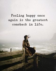 a woman sitting on top of a wooden fence next to the ocean with a quote about feeling happy once again