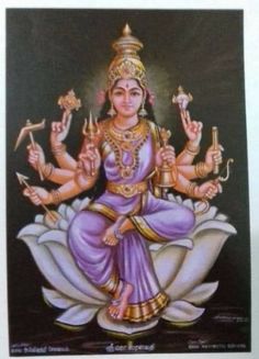 an image of the goddess sitting on top of a flower with two hands in her lap