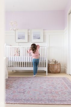 A Sweet and Colorful Baby Girl Nursery | Reveal | Nick + Alicia Bassinet Nursery, Nursery Toy Storage, Nursery Paint, Nursery Paint Colors, Lavender Nursery, Pink Paint Colors, Colorful Nursery, Purple Nursery, Big Girl Bedrooms