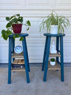 two plant stands sitting next to each other