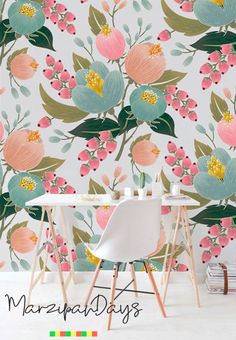 the wallpaper in this room is very colorful and has flowers on it, as well as green leaves