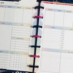 an open planner book sitting on top of a desk