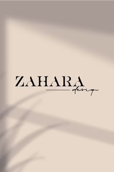 the word zahara is written in black on a white background with long shadows