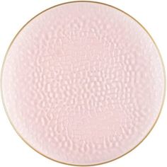 a pink plate with gold trim