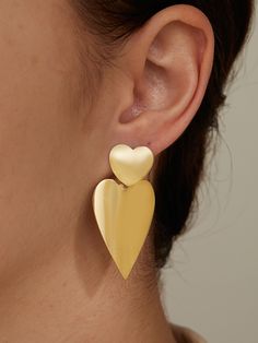 Unique Gold Heart-shaped Earrings, Modern Heart-shaped Metal Earrings, Gold Enamel Heart Charm Earrings, Affordable Heart-shaped Statement Earrings, Nickel-free Gold Heart Earrings In Brass, Pendant Earrings