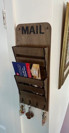 the mail holder is hanging on the wall