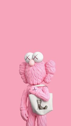 a pink teddy bear holding a white bag on top of it's back legs