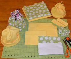 sewing supplies are laid out on a cutting board