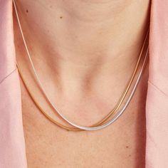 Embrace the elegance of our Snake Chain Necklace, a staple piece to add sophistication to every look. Perfect for wearing alone or for layering alongside your favourite Merci Maman personalized necklaces, this chain is a timeless way to elevate your everyday jewelry collection.&nbsp;18K Champagne Gold Plated or 925 Sterling SilverLength: 0.4Width: 0.09Thickness: 0.05Sent with love in a complimentary gift box Everyday Rose Gold Snake Chain Necklace, Elegant Sterling Silver Charm Necklace With Snake Chain, Elegant Everyday Necklace With Snake Chain, Silver Gold-plated Snake Chain Necklace, Classic Chain Necklace For Layering, Delicate Rose Gold Box Chain Necklace, Elegant White Gold Chain Necklace For Layering, Elegant Snake Chain Charm Necklace For Everyday, Elegant Charm Necklace With Adjustable Snake Chain