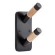 two wooden crayons sticking out of the side of a black wall mounted holder