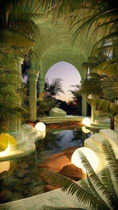 an outdoor pool surrounded by palm trees and water features lights that illuminate the light