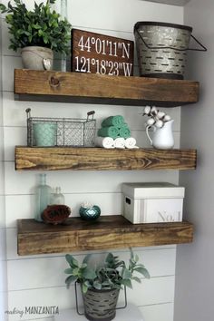 three wooden shelves with plants and other items on them