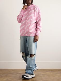 Vetements' sweater is knitted with a recurring pattern of the recognisable moniker and metallic threads for a subtle sparkle. It has an oversized fit emphasised by dropped shoulders. Cute Pink Sweater For Streetwear, Oversized Pink Sweater For Streetwear, Pink Sweater Men, Oversized Pink Letter Print Sweater, Oversized Soft-washed Sweater For Streetwear, Pink Graphic Print Sweater, Oversized Sweater Men, Destroyed Sweater, Monogram Sweater