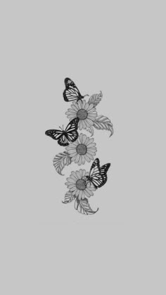 three butterflies flying over flowers on a gray background