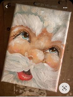 a painting of a santa clause with blue eyes