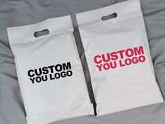 two bags that say custom you logo on them