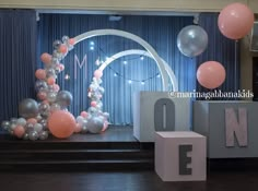 balloons and letters are on the stage for an event