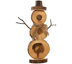 a snowman made out of tree slices