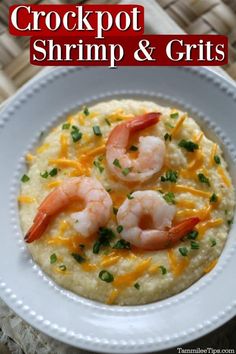 a white plate topped with shrimp and grits