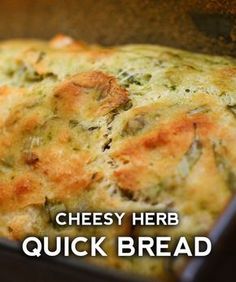 cheesy herb quiche bread in a baking pan with text overlay reading cheesy herb quick bread