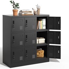 a black locker with several compartments and a plant on top