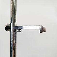 a close up of a metal pole on a white background with no one around it