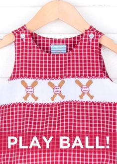 Prepare for baseball season in style with our Baseball Smocked Red Plaid Sun Bubble. This charming red gingham plaid bubble features smocked bats and baseballs, creating a playful and sporty look. The thoughtful design includes convenient shoulder buttons and snaps in the stride, ensuring easy dressing and undressing for your child. childrens clothing, baseball season, baseball smocking, gingham outfit, red gingham, baseball bat and ball, bubble, jon jon, short set, dress, ruffles, little girls baseball outfit, little boys baseball outfit, mlb, mlb game, mlb gameday ootd, spring training outfit, play ball, kids mlb game outfit, red baseball teams, southern sunshine, kids playwear, classic whimsy, smocked auction, Dallas Texas, online shopping, kids clothing collection, summer baseball Smocking Pattern