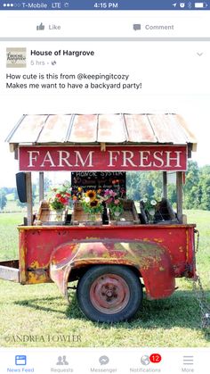 an old farm fresh truck is parked in the grass with sunflowers on it