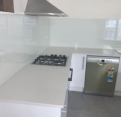 a stove top oven sitting inside of a kitchen