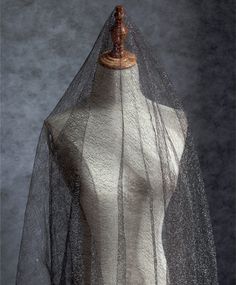 a mannequin wearing a veil on top of it