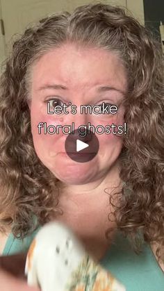 a woman with curly hair is holding a small white dog in her hands and the caption says let's make floral ghosts