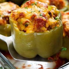 green peppers stuffed with cheese and meat in a casserole dish, ready to be eaten