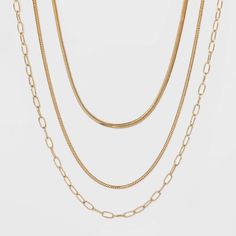 Your jewelry box will get an effortlessly chic update from this Round Flat Snake Chain Necklace from A New Day™. It comes with an additional snake chain necklace and a simple, versatile chain link necklace. The flat design of the snake chains lends sleek, feminine flair you'll love pairing with other gold-finished pieces. You can adorn the chain with charms for a touch of unique style, and the princess lengths of each necklace highlight your collarbone. Wear them all together for a layered look, Gold Snake Chain Layered Necklace, Chain With Charms, Flat Snake Chain, Snake Chain Necklace, The Snake, Cute Necklace, The Princess, Chain Link Necklace, Link Necklace