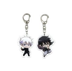 two keychais with anime characters on them, one is black and the other is white