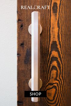 a wooden door handle with the words realcraft on it and an image of wood planks