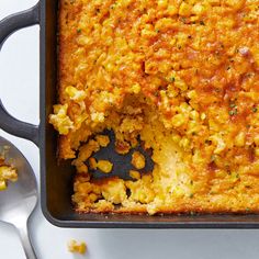 a casserole dish with corn and cheese