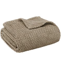 an image of a blanket that is folded on top of each other in beige colors