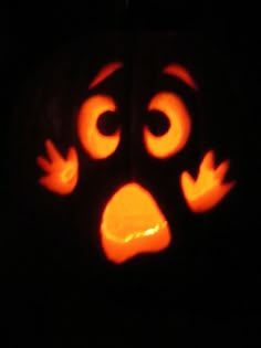 a carved pumpkin with an angry face on it's side and eyes drawn out