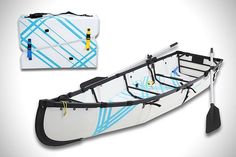 a white and blue kayak with paddles attached to it