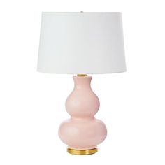 a pink lamp with a white shade on it