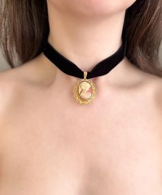 PLEASE READ DESCRIPTION CAREFULLY: Black velvet choker with VINTAGE André Rivalle cameo/ watch pendant (cameo is faced frontward) The watch still works! To adjust the time: pull out the side knob, adjust to current time, push knob in and wind downward!  Made with high quality, double sided velvet! Adjustable gold plated brass chain with lobster clasp in back. One size fits most! Materials may not be suitable for those with skin allergies.  These necklaces are not suitable to wear in water, as it will tarnish the quality. I sell both modern and vintage jewelry. Vintage items will be marked vintage! Watch Pendant, Black Velvet Choker, Velvet Choker, Skin Allergies, Cameo Necklace, Brass Chain, Jewelry Vintage, Victorian Style, Victorian Fashion