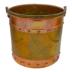 an old metal bucket with rivets on it