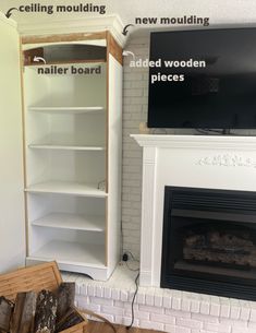 a living room with a fireplace, tv and shelves